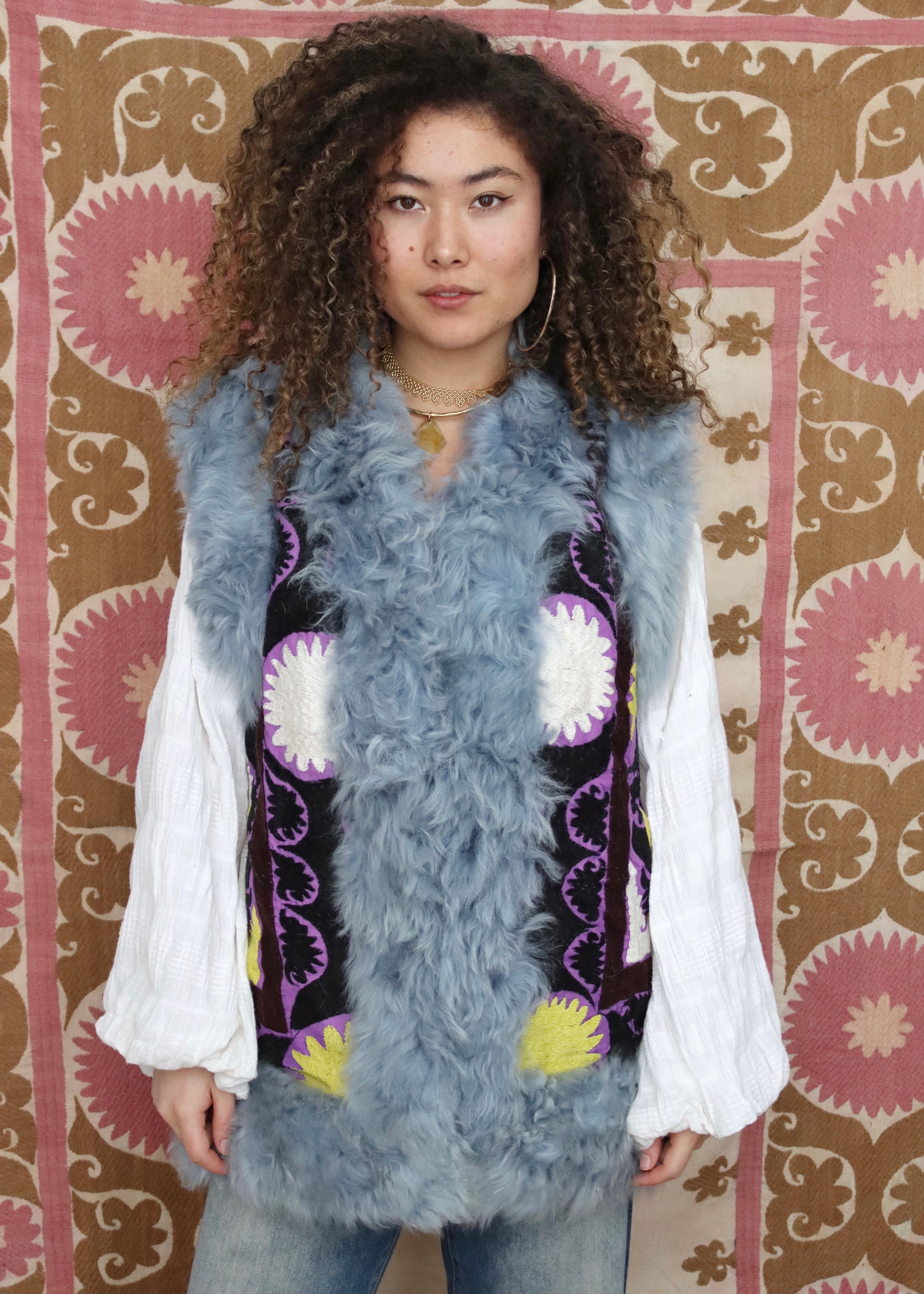 Purple black and multi coloured suzani with blue fur trim